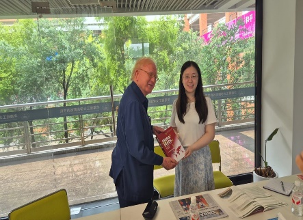 Dr Junaid Ahmad presenting his book on China to Ms Sarah Deng of the SCUT International Admissions Office.